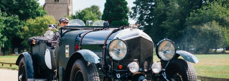 vintage roadster car on concrete road